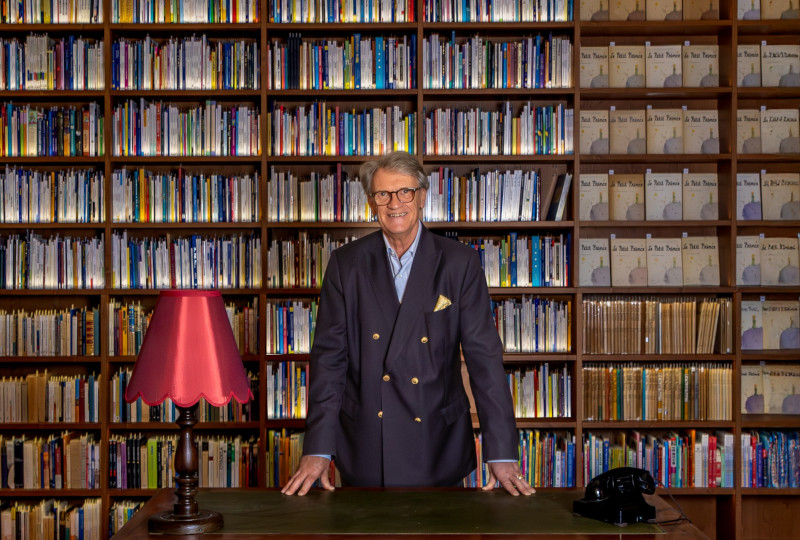 Jean-Marc Probst amid his book collection of the Little Prince in Lausanne, Switzerland